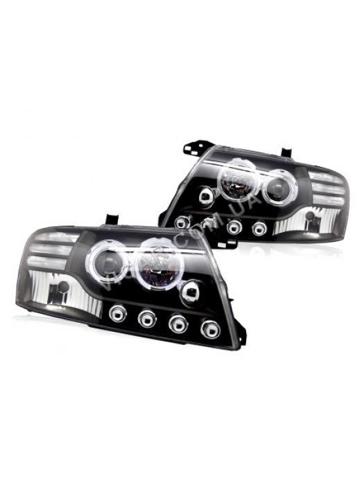 Передняя линзовая оптика Mitsubishi Pajero III (01-06)